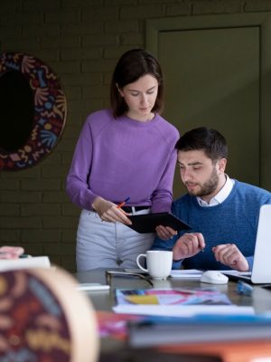 medium-shot-people-working-office_23-2149345227