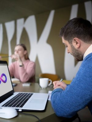 medium-shot-people-working-with-laptop_23-2149345218